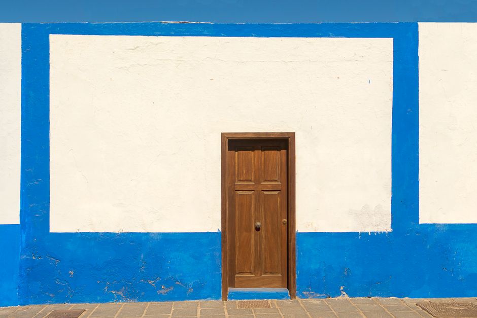 Close view of a painted exterior wall and window
